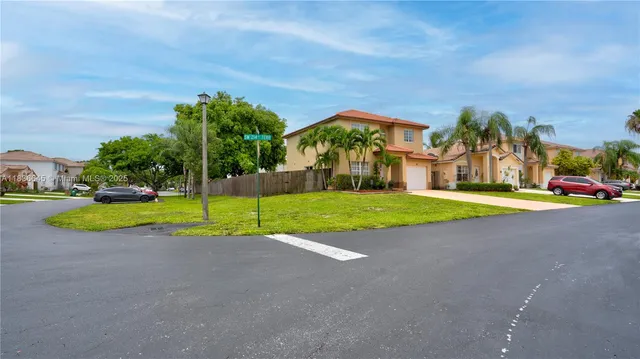 a view of a house with a swimming pool