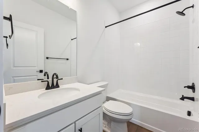a bathroom with a sink a toilet and a bathtub