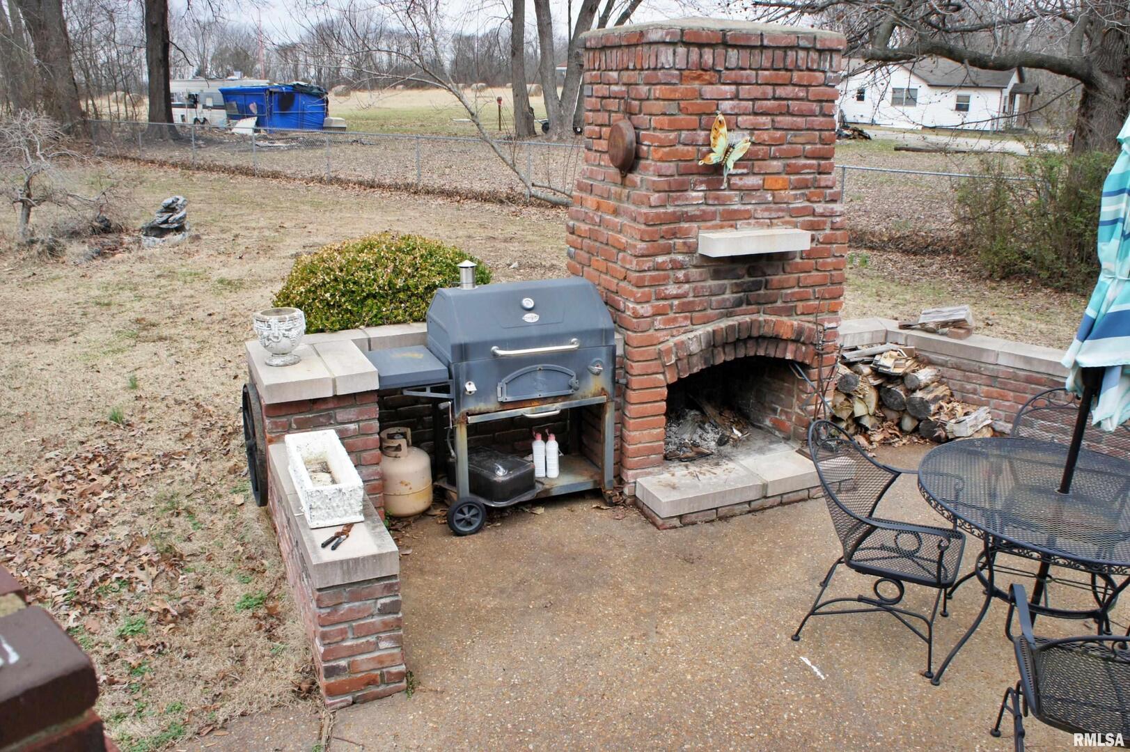 6752 South US 45 Road Brookport, IL 62910 - Photo 12 of 62 a building with a table and chairs in front of it