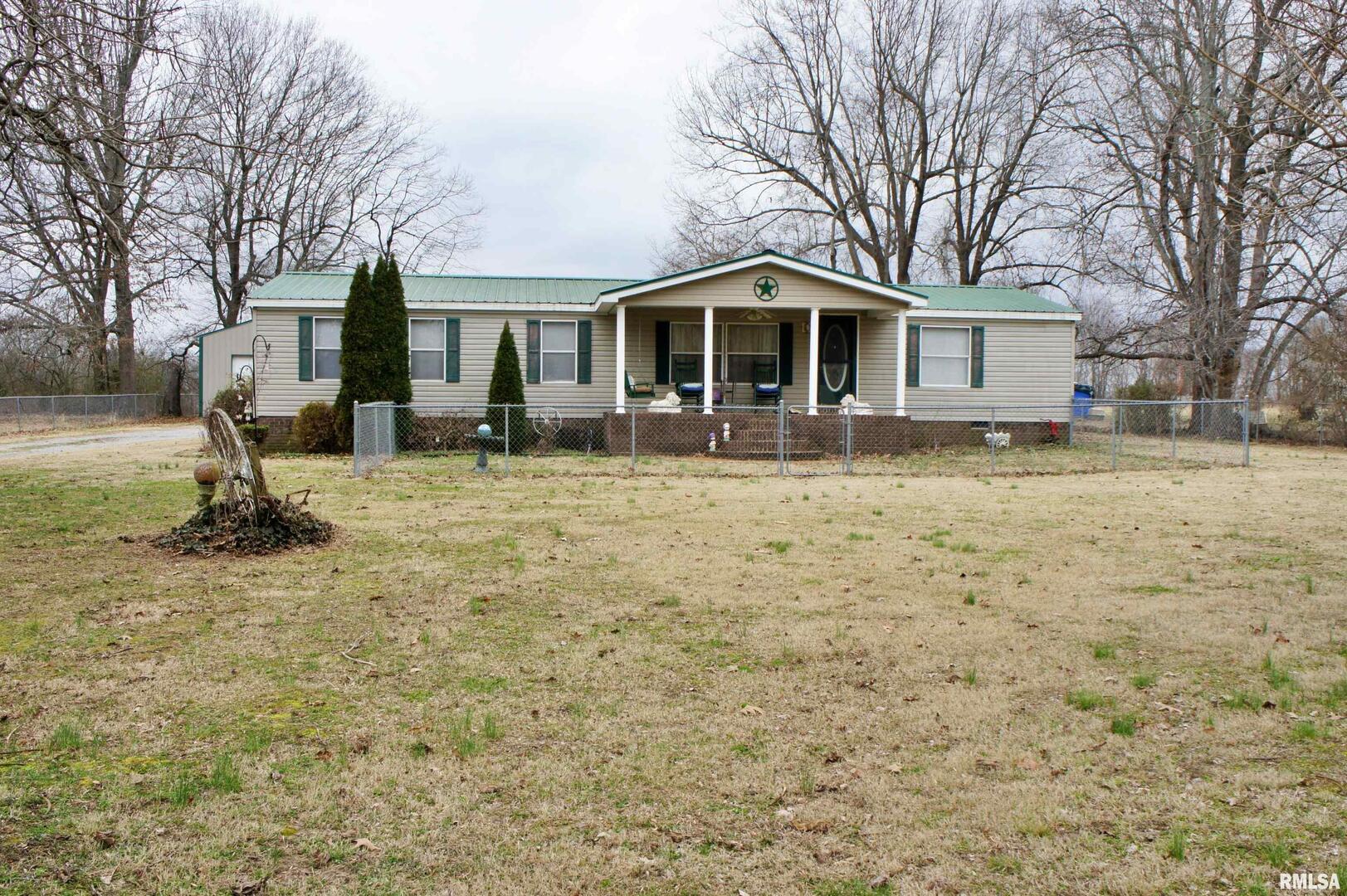 6752 South US 45 Road Brookport, IL 62910 - Photo 2 of 62 a front view of a house with a yard