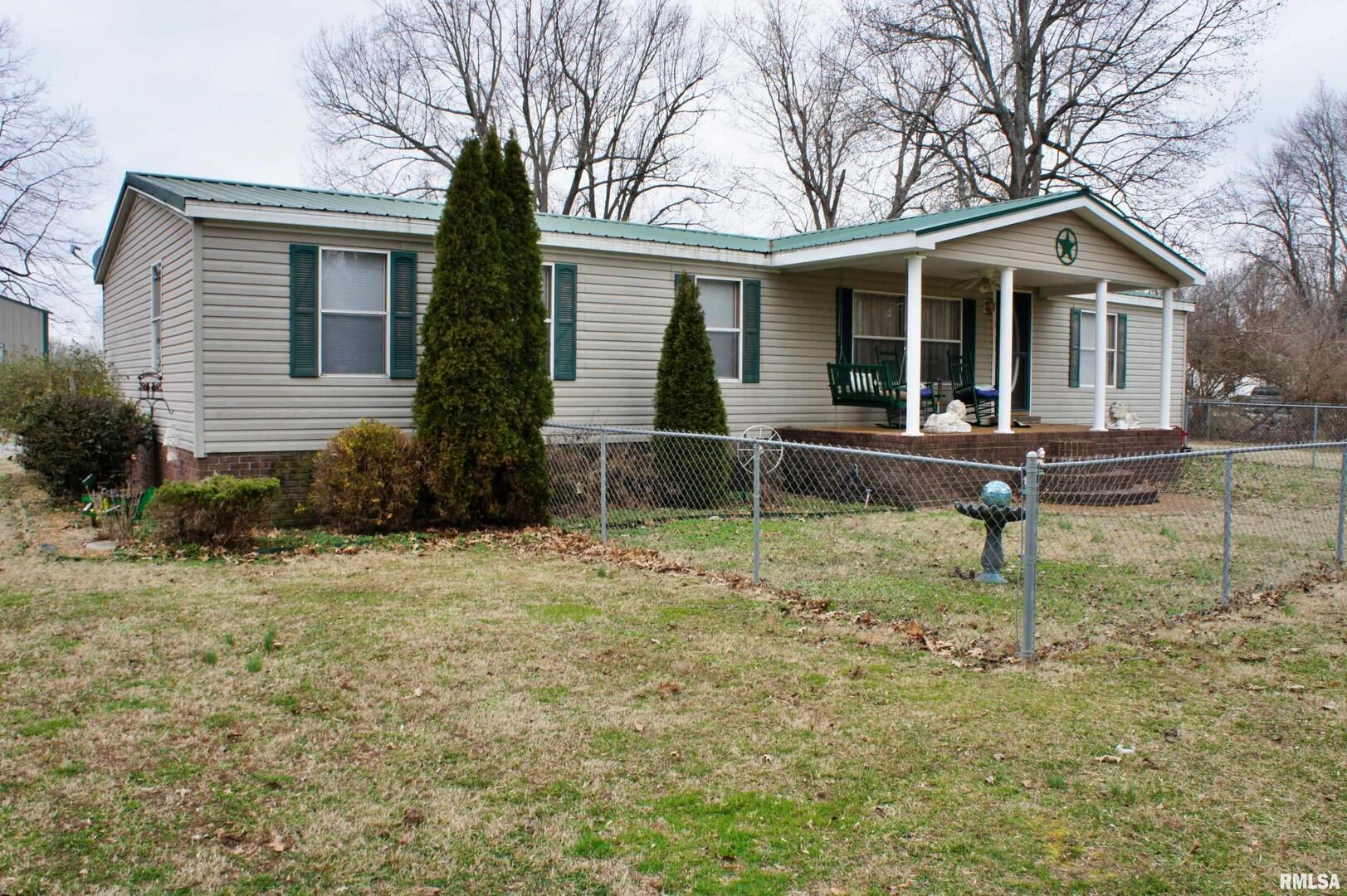 6752 South US 45 Road Brookport, IL 62910 - Photo 3 of 62 a front view of a house with garden