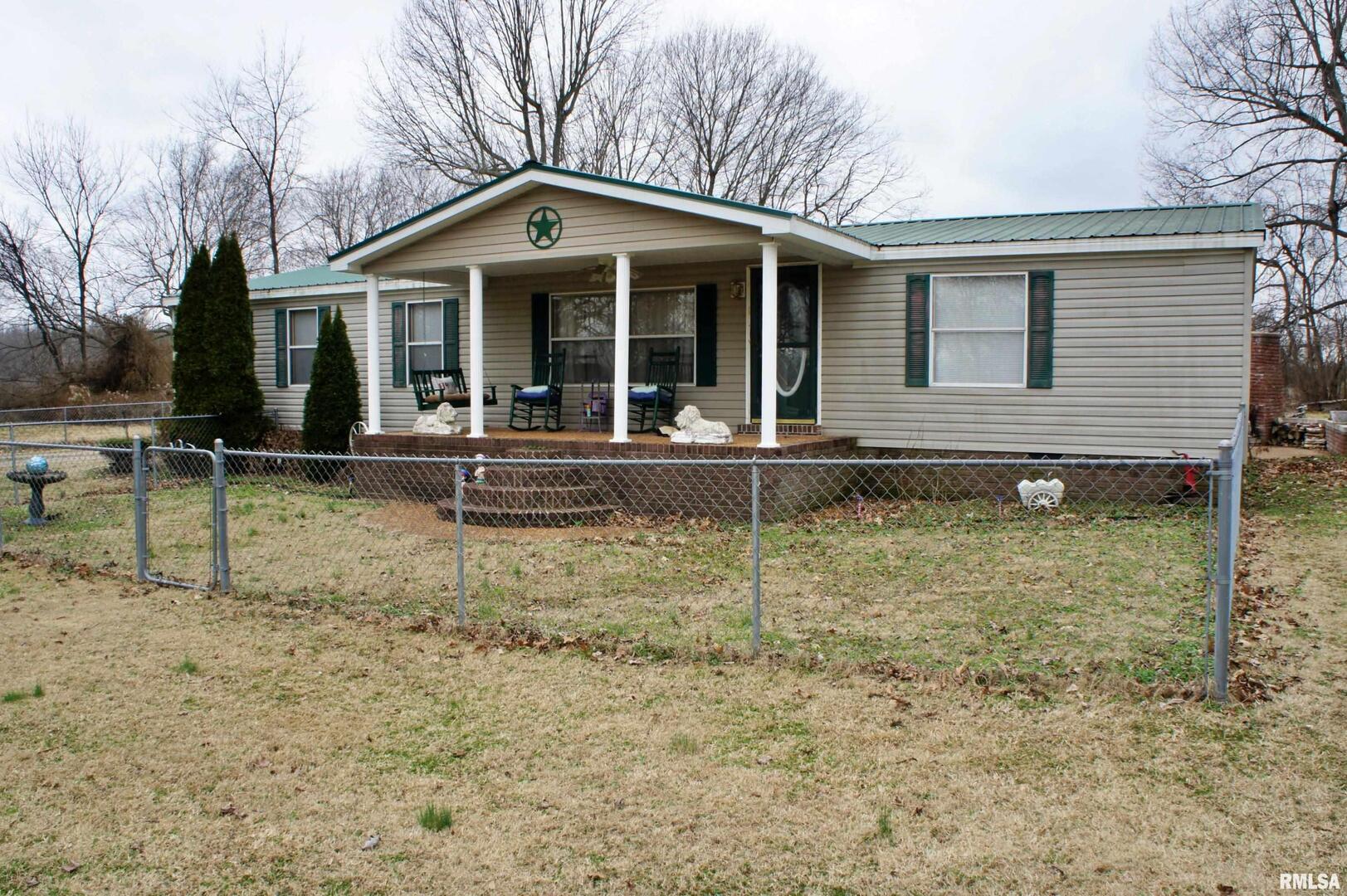 6752 South US 45 Road Brookport, IL 62910 - Photo 4 of 62 a front view of a house with garden