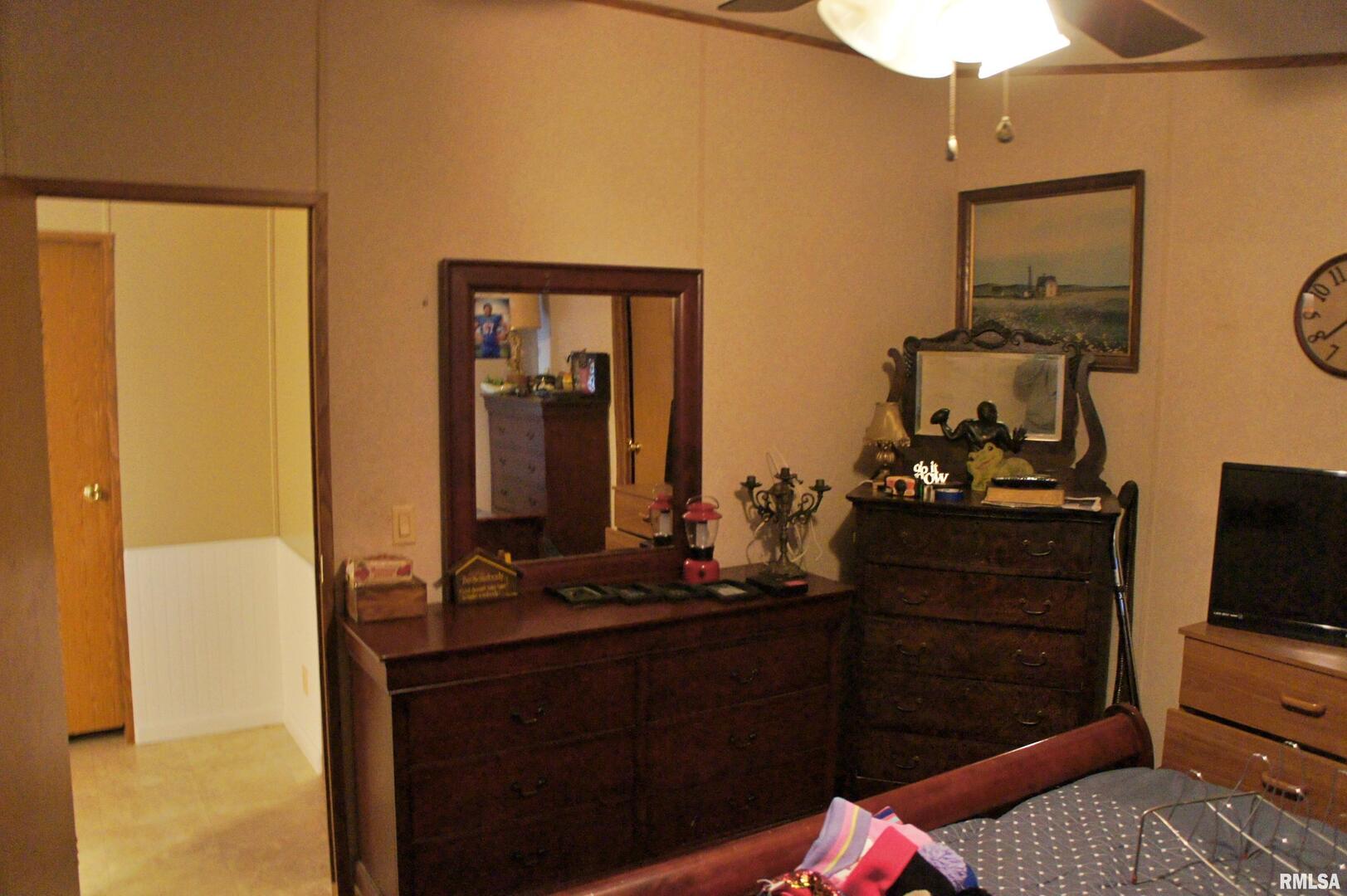 6752 South US 45 Road Brookport, IL 62910 - Photo 43 of 62 a bathroom with a sink and a mirror