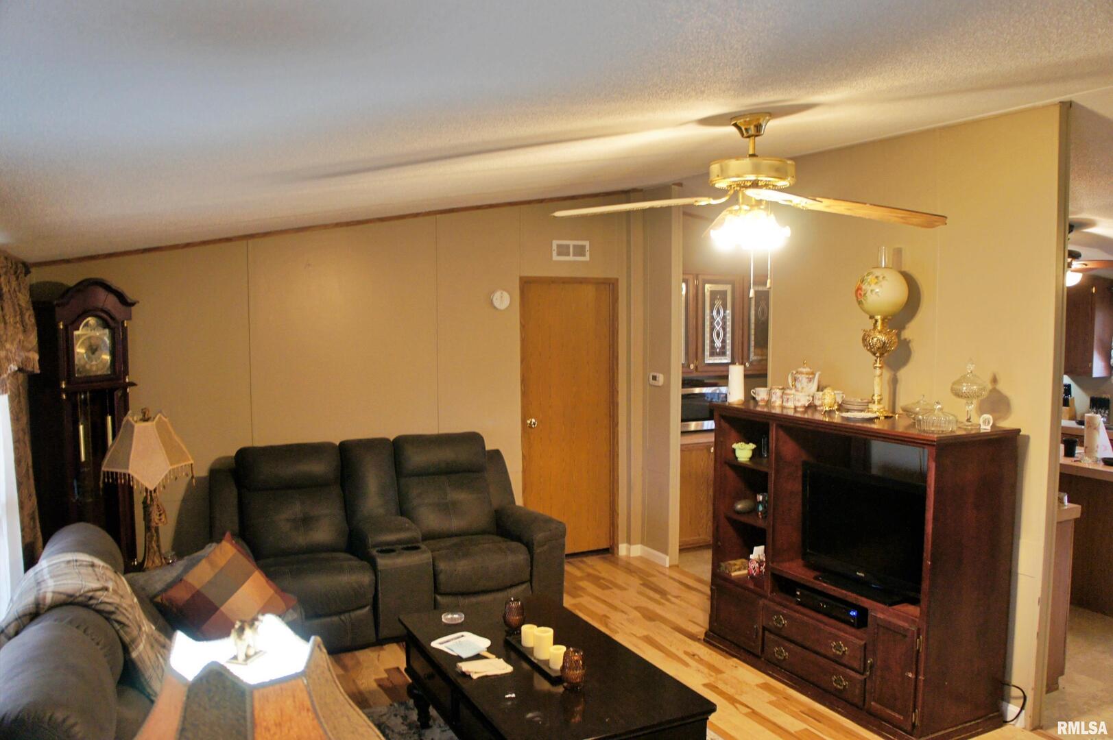 6752 South US 45 Road Brookport, IL 62910 - Photo 46 of 62 a living room with furniture and a flat screen tv