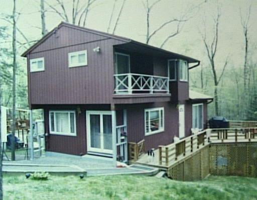 58 Hunter Road Danbury, CT 06811 - Photo 1 of 1 a front view of a house with garden
