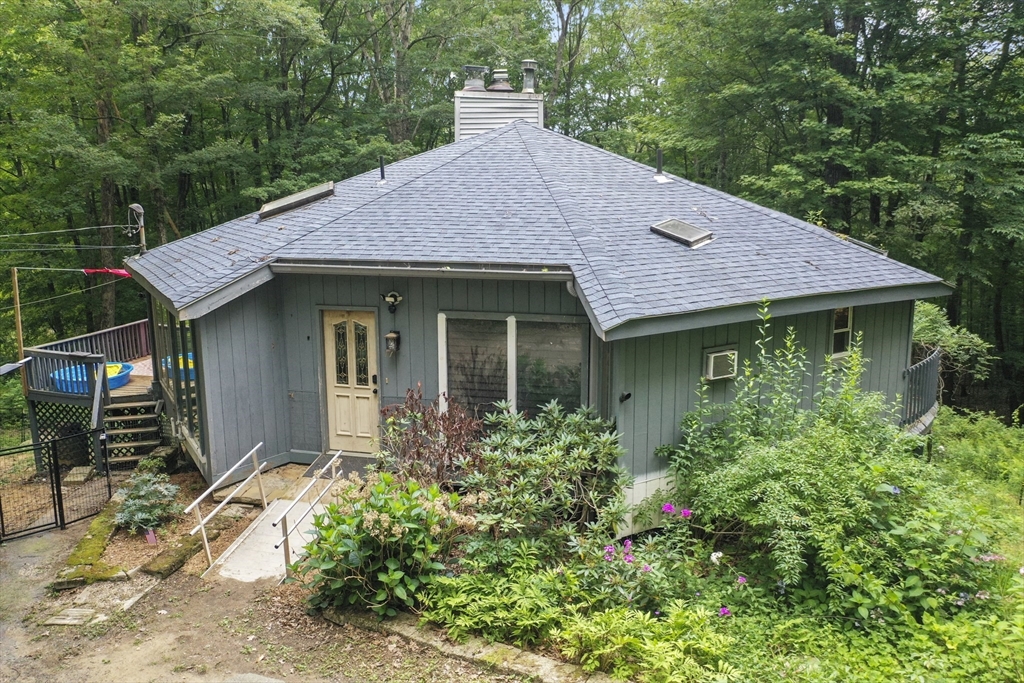77 Vinton Road Holland, MA 01521 - Photo 1 of 31 a front view of a house with garden