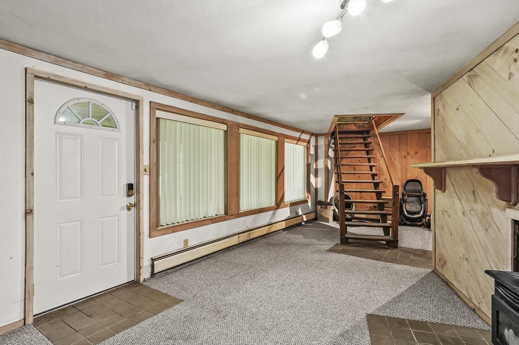 77 Vinton Road Holland, MA 01521 - Photo 16 of 31 wooden floor in an empty room with a window