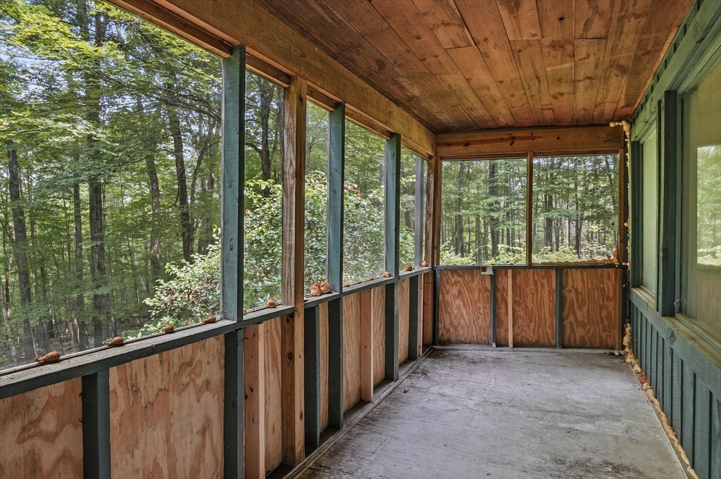 77 Vinton Road Holland, MA 01521 - Photo 19 of 31 a view of a porch with wooden floor and roof