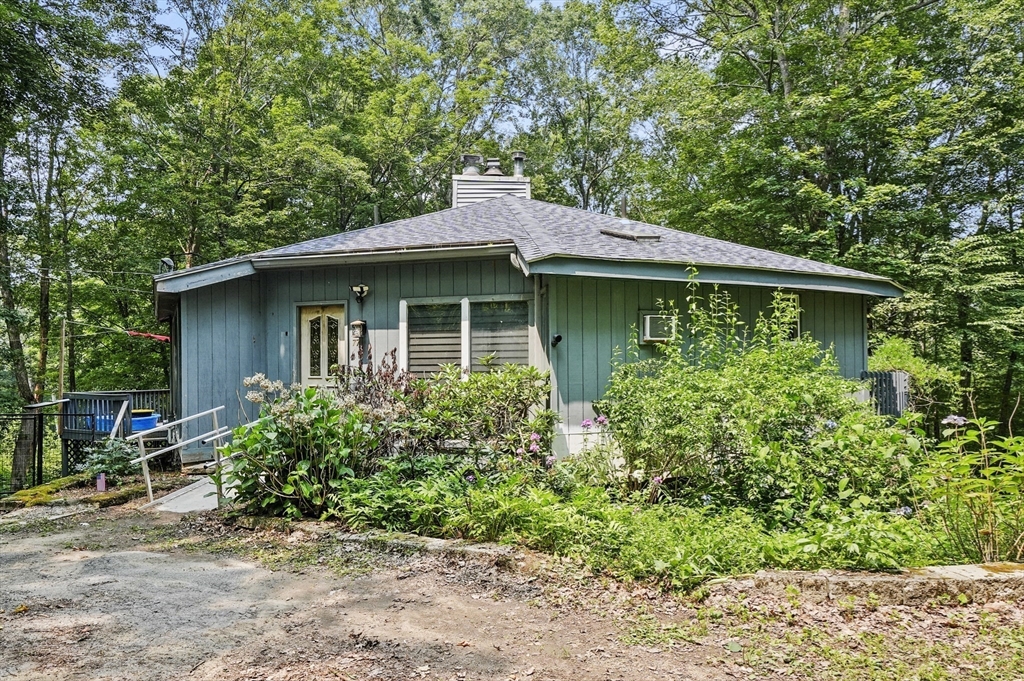 77 Vinton Road Holland, MA 01521 - Photo 2 of 31 a front view of a house with garden
