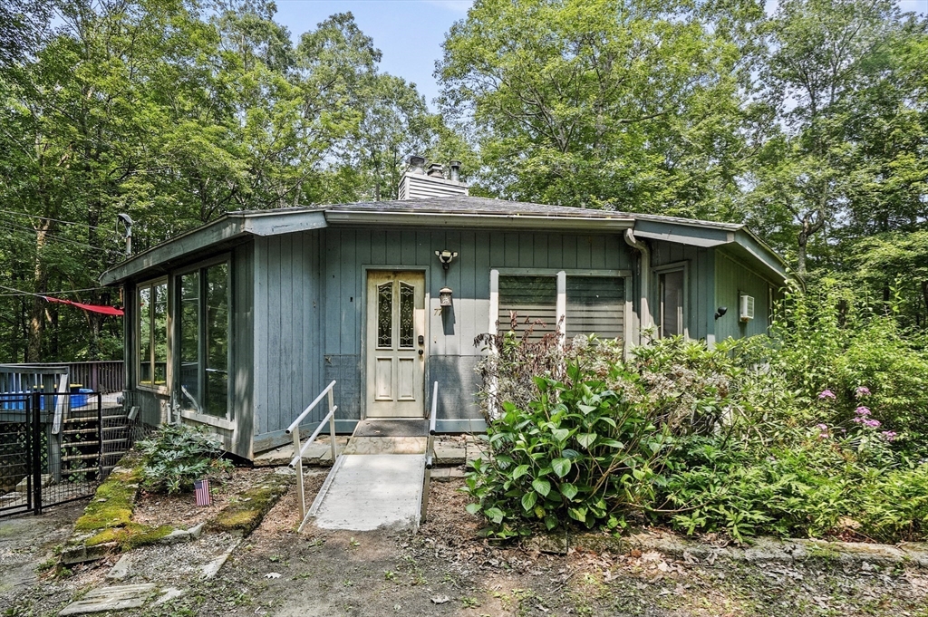 77 Vinton Road Holland, MA 01521 - Photo 22 of 31 a front view of a house with garden