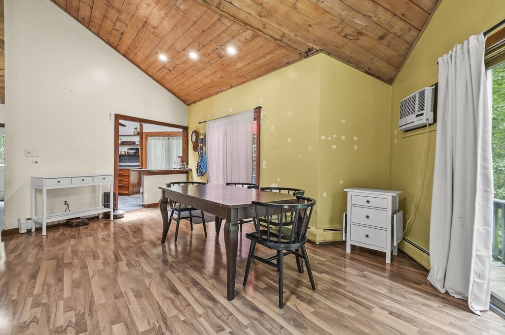 77 Vinton Road Holland, MA 01521 - Photo 7 of 31 a view of a dining room with furniture and a wooden floor