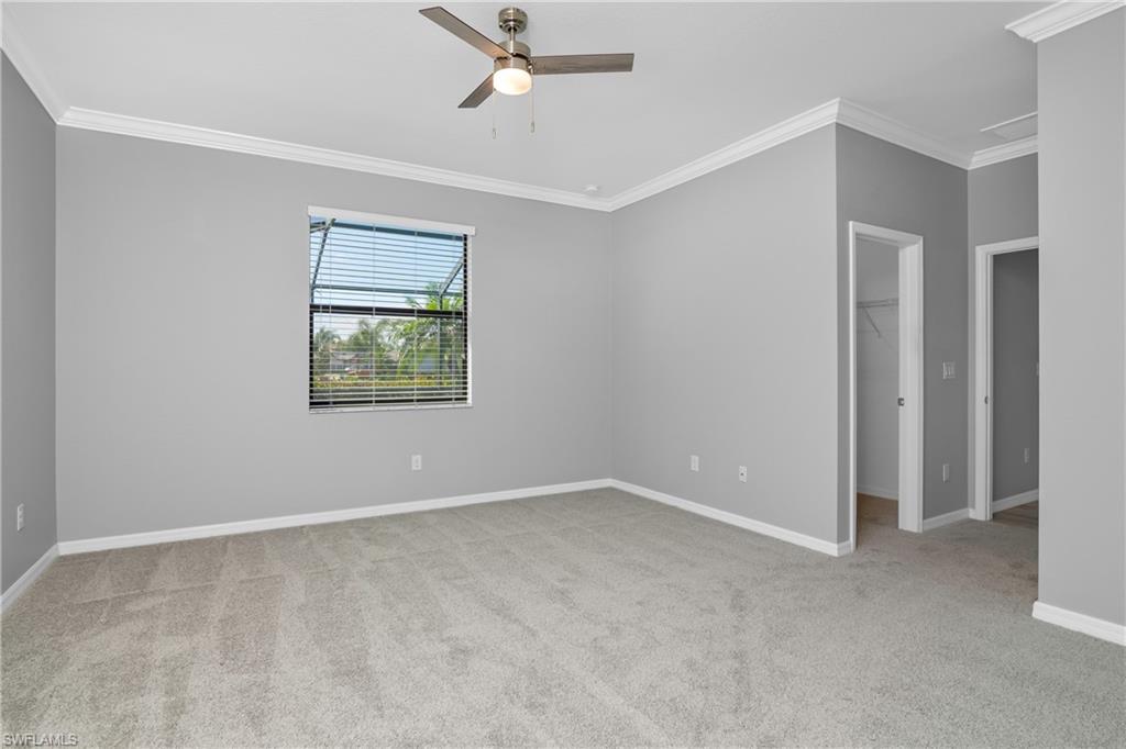 19952 Beverly Park Road Estero, FL 33928 - Photo 11 of 32 an empty room with windows and closet