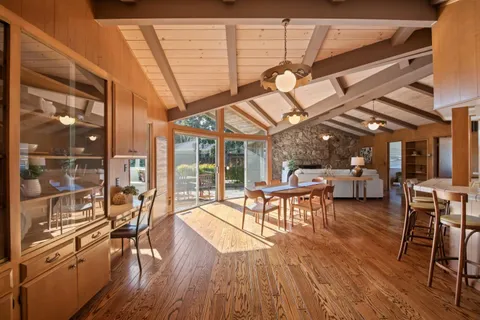 a view of a patio with table and chairs