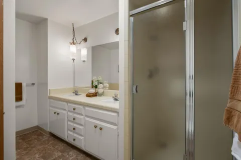 a bathroom with a bathtub and a window