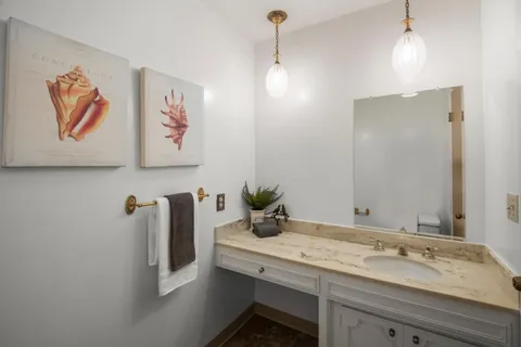 a view of a patio with table and chairs with wooden floor and fence