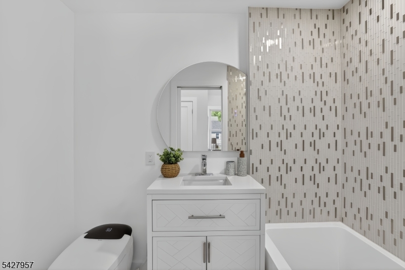 909 Ridgewood Road Millburn, NJ 07041 - Photo 15 of 33 a bathroom with a sink toilet and shower