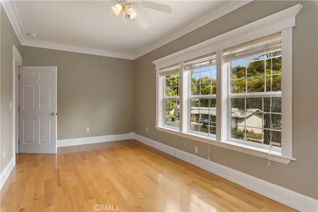 a view of a patio with table and chairs and wooden floor