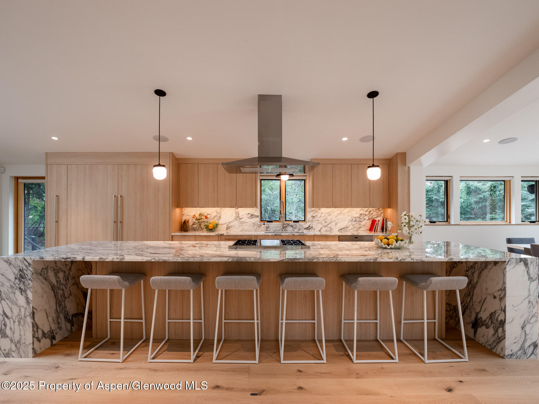 51 Roaring Fork Drive Aspen, CO 81611 - Photo 13 of 30 a kitchen with a sink and chairs