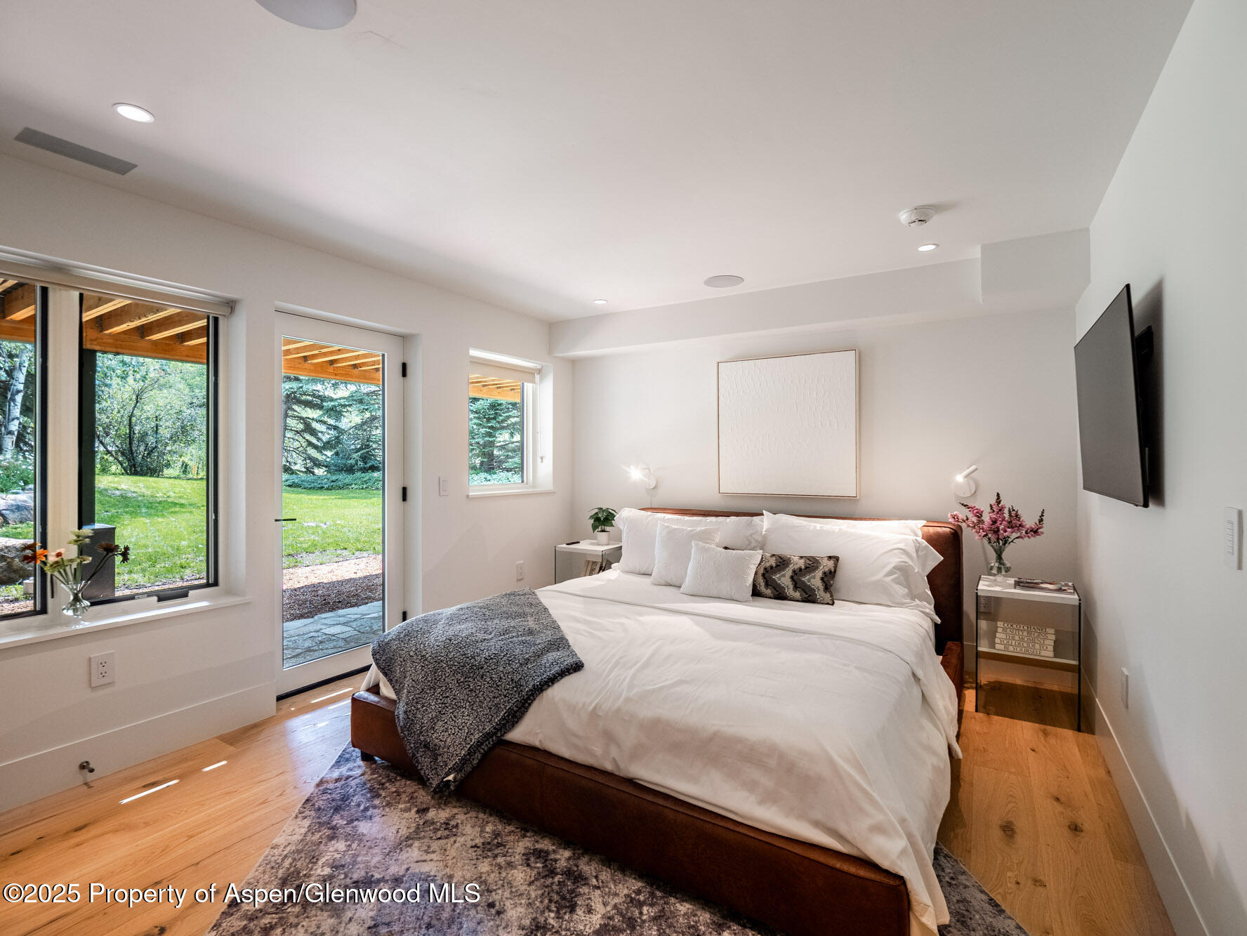 51 Roaring Fork Drive Aspen, CO 81611 - Photo 21 of 30 a bedroom with a large bed and a large window
