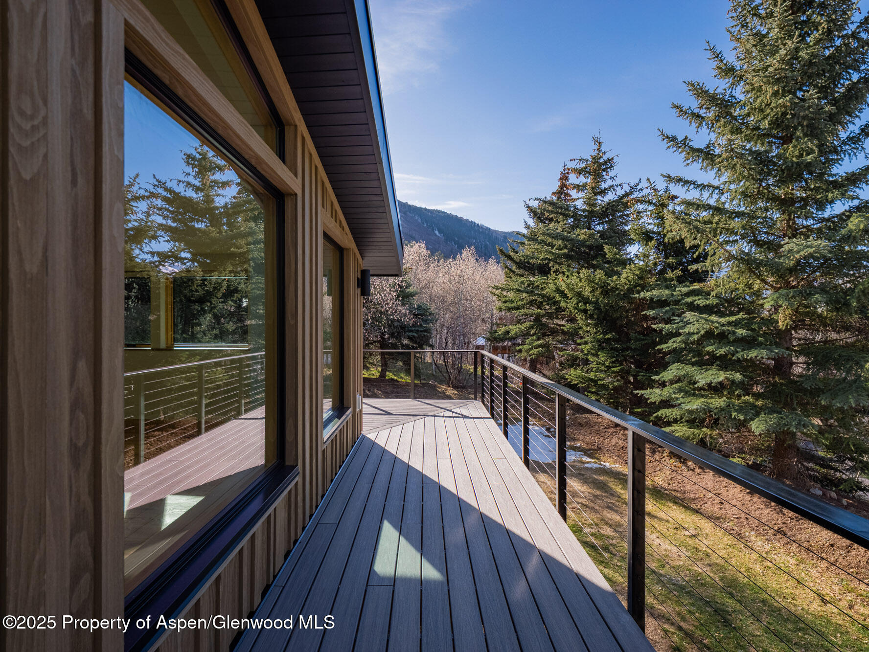 51 Roaring Fork Drive Aspen, CO 81611 - Photo 5 of 30 a view of balcony with wooden floor and fence