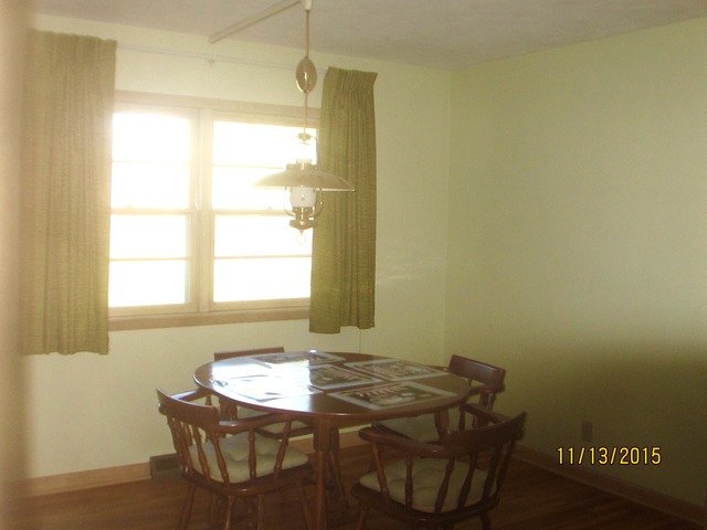 2223 Garden Road Aurora, IL 60506 - Photo 4 of 12 a view of a room that has a table and a chair in it