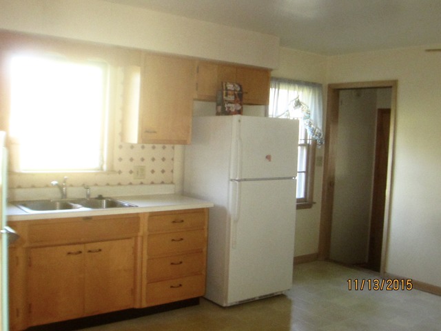 2223 Garden Road Aurora, IL 60506 - Photo 5 of 12 a kitchen with a refrigerator sink and cabinets