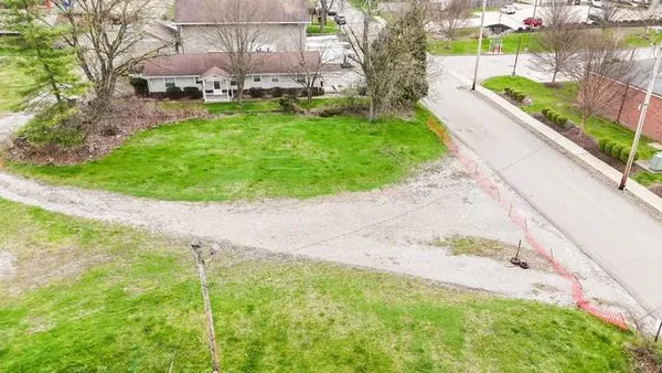 a view of backyard with swimming pool