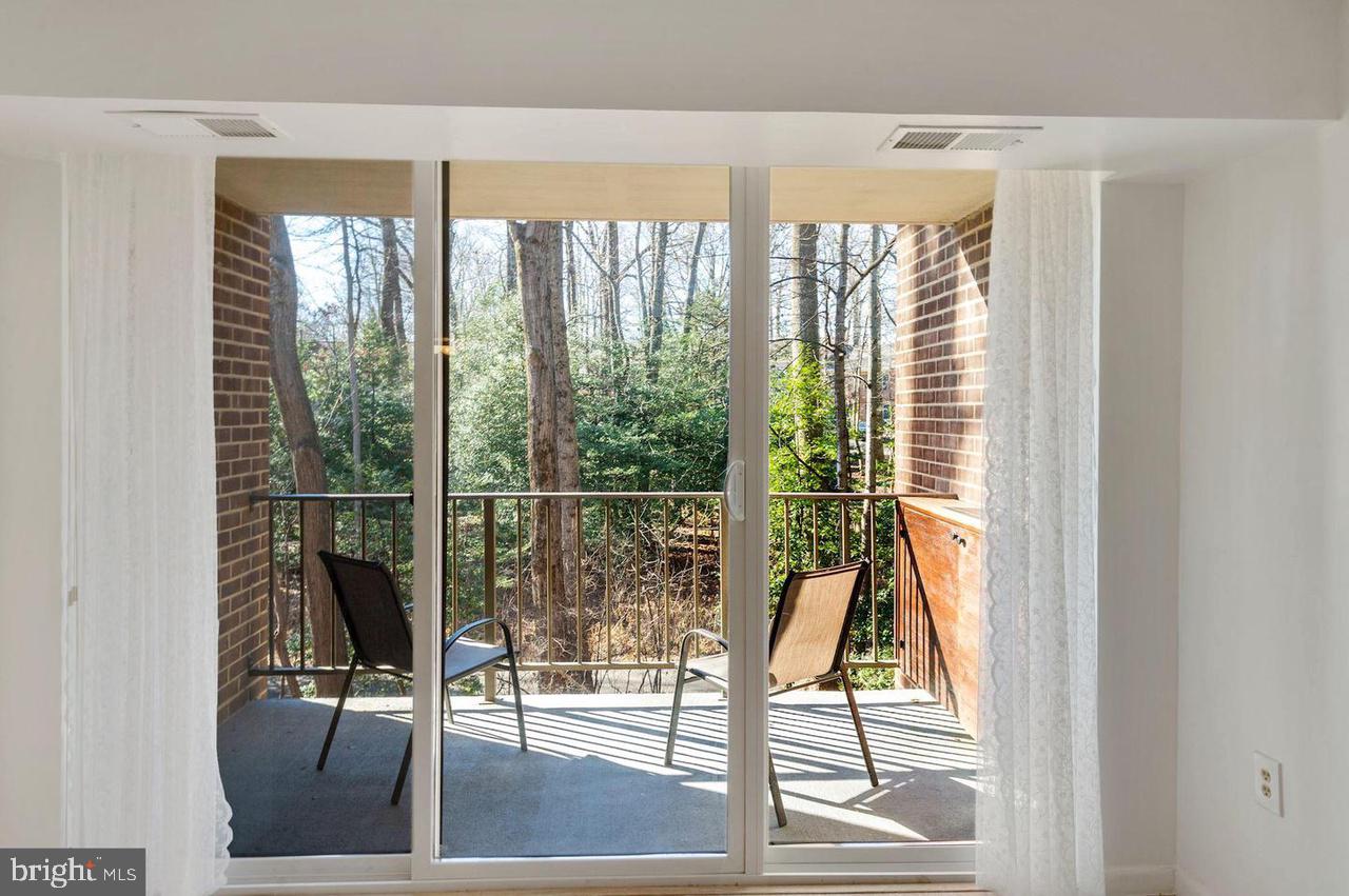 1532 Northgate Square, Unit 12A Reston, VA 20190 - Photo 7 of 20 a living room with hardwood floor and floor to ceiling windows