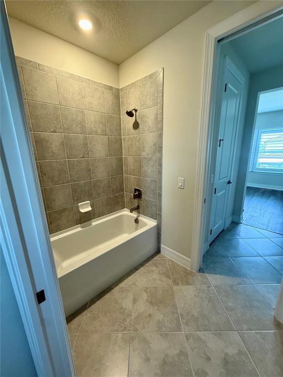 8441 Pk Clf Way Orlando, FL 32836 - Photo 31 of 59 a spacious bathroom with a tub shower and a sink