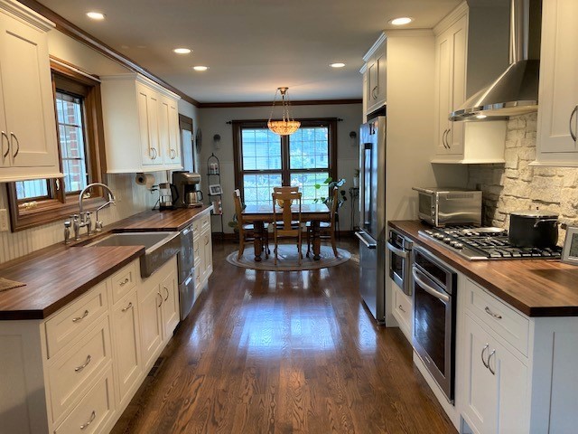 6-n143 Woodland Road St. Charles, IL 60175 - Photo 3 of 17 a kitchen with granite countertop a sink a counter top space appliances and cabinets