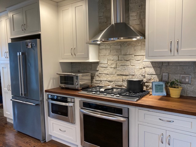 6-n143 Woodland Road St. Charles, IL 60175 - Photo 5 of 17 a kitchen with stainless steel appliances granite countertop a stove a refrigerator and cabinets