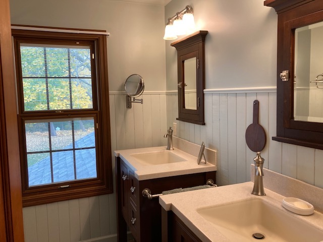 6-n143 Woodland Road St. Charles, IL 60175 - Photo 8 of 17 a bathroom with a sink and a mirror