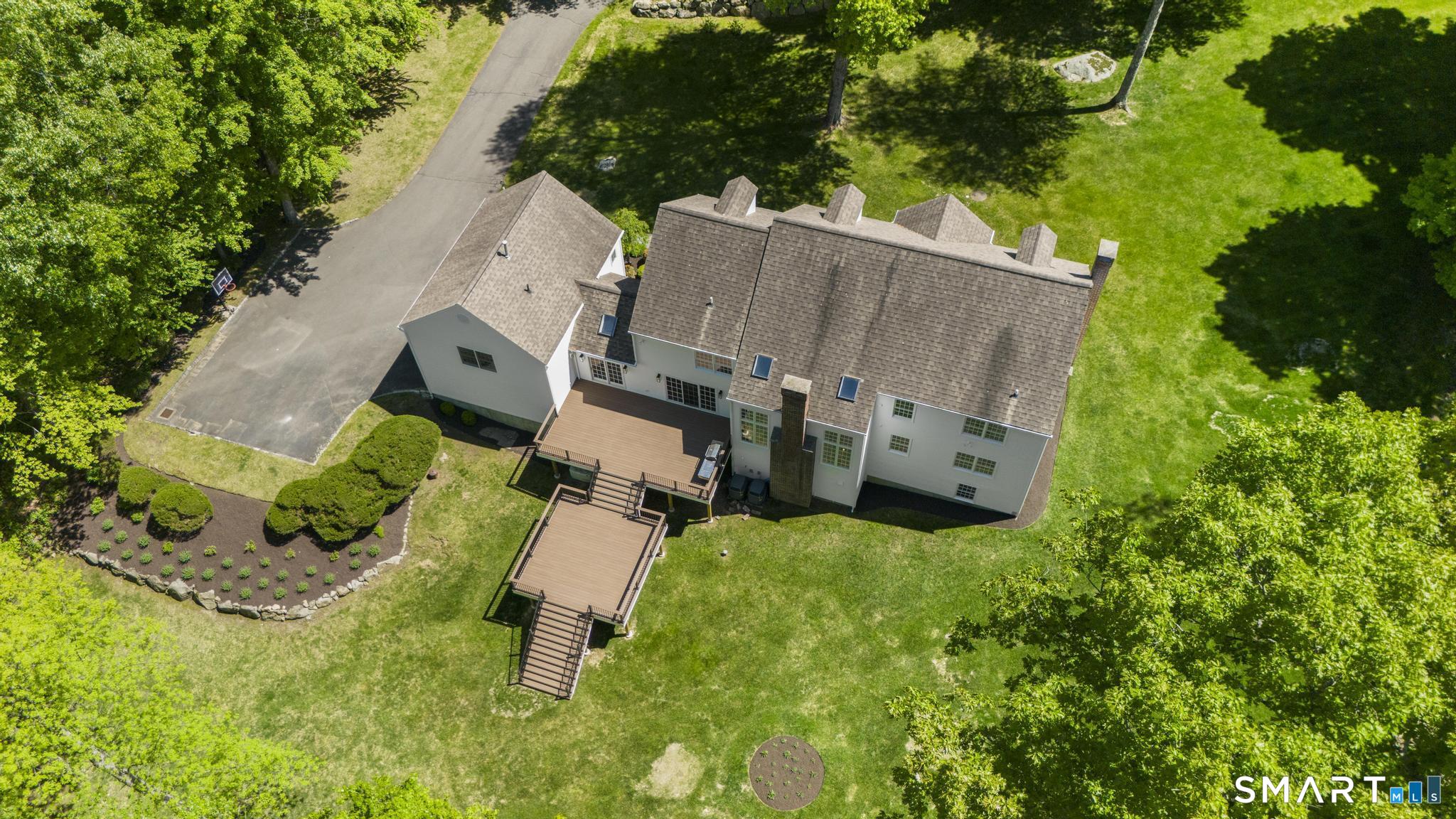 181 Old Branchville Road Ridgefield, CT 06877 - Photo 5 of 40 an aerial view of a house with a yard and trees