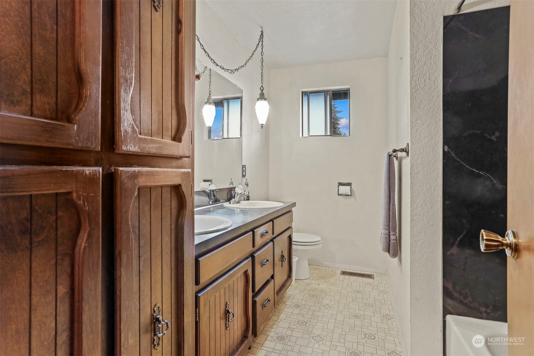 22224 4th Avenue Southeast Bothell, WA 98021 - Photo 15 of 23 a bathroom with a sink a mirror and shower