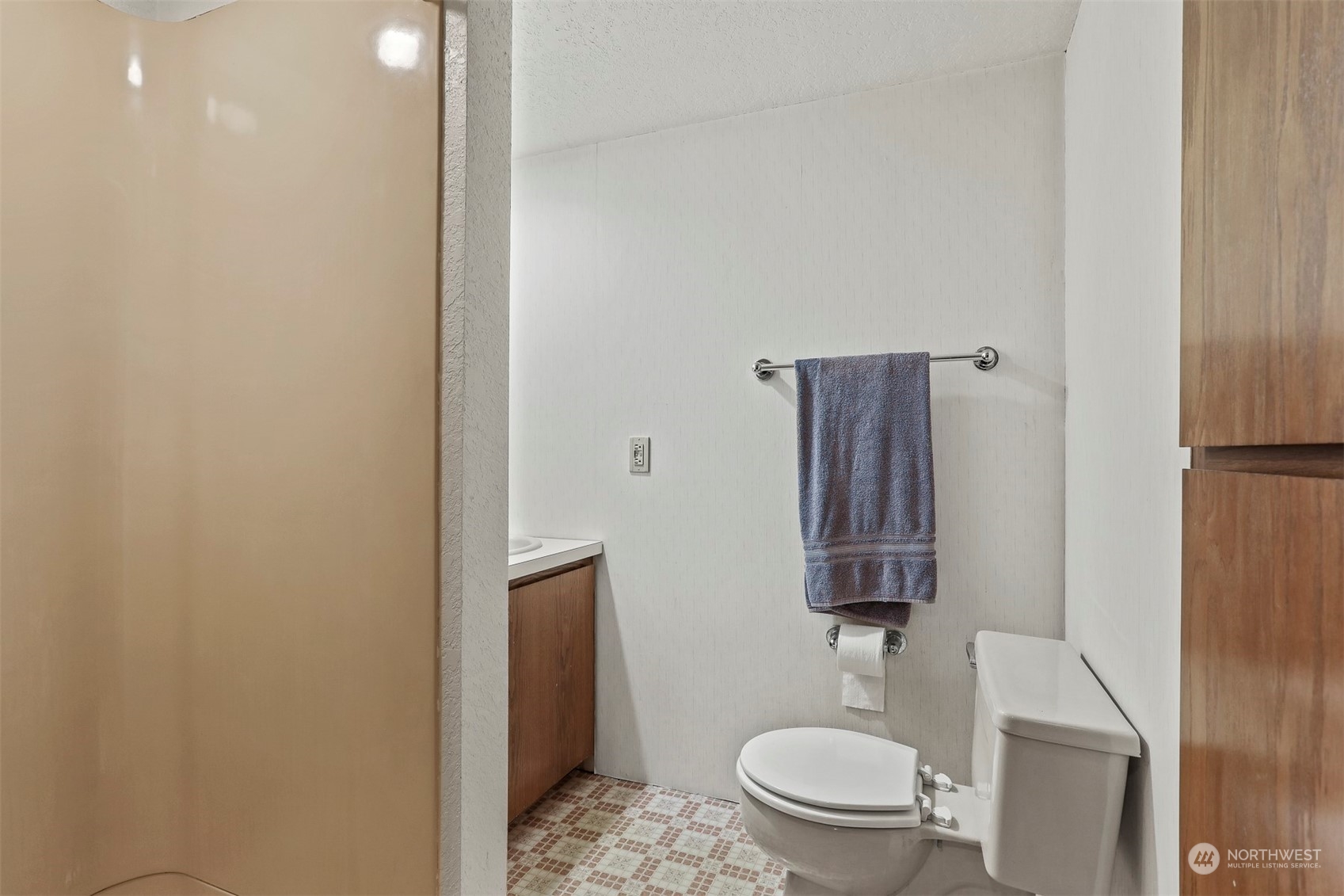 22224 4th Avenue Southeast Bothell, WA 98021 - Photo 16 of 23 a white toilet sitting next to a bathroom sink and a mirror