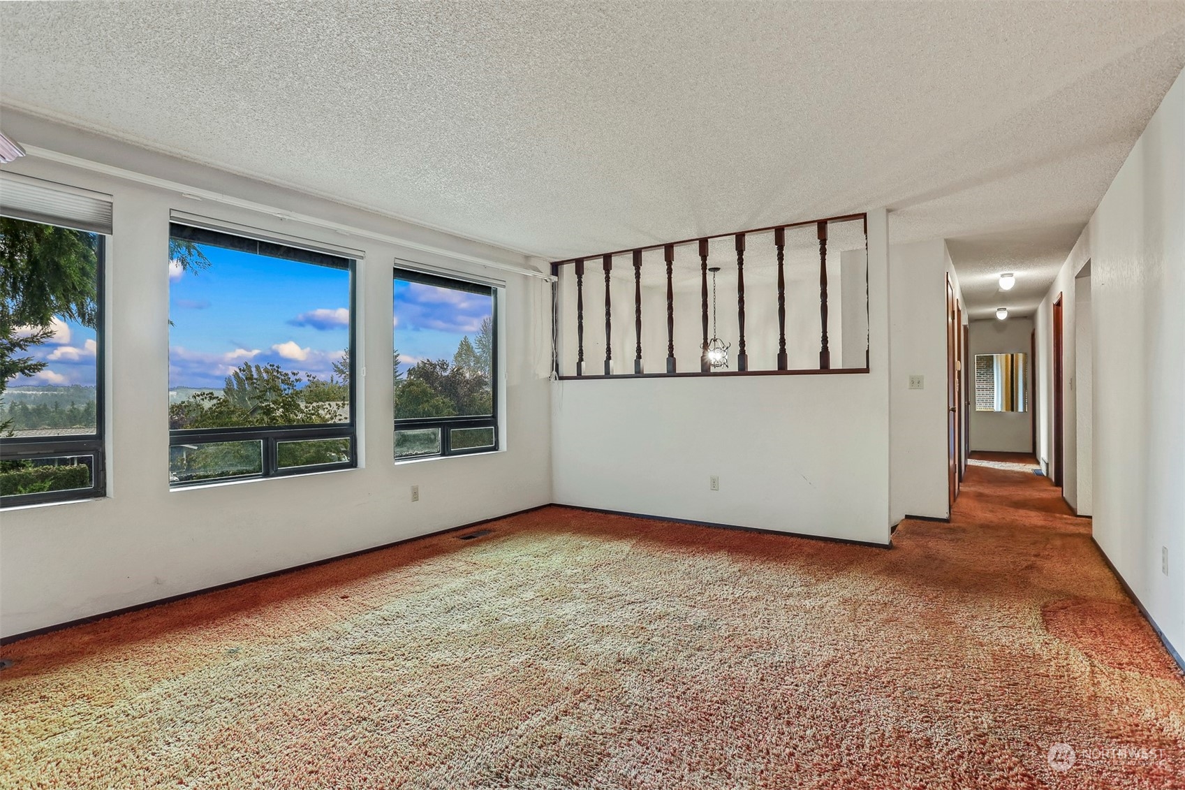 22224 4th Avenue Southeast Bothell, WA 98021 - Photo 2 of 23 a view of an empty room with wooden floor and a window
