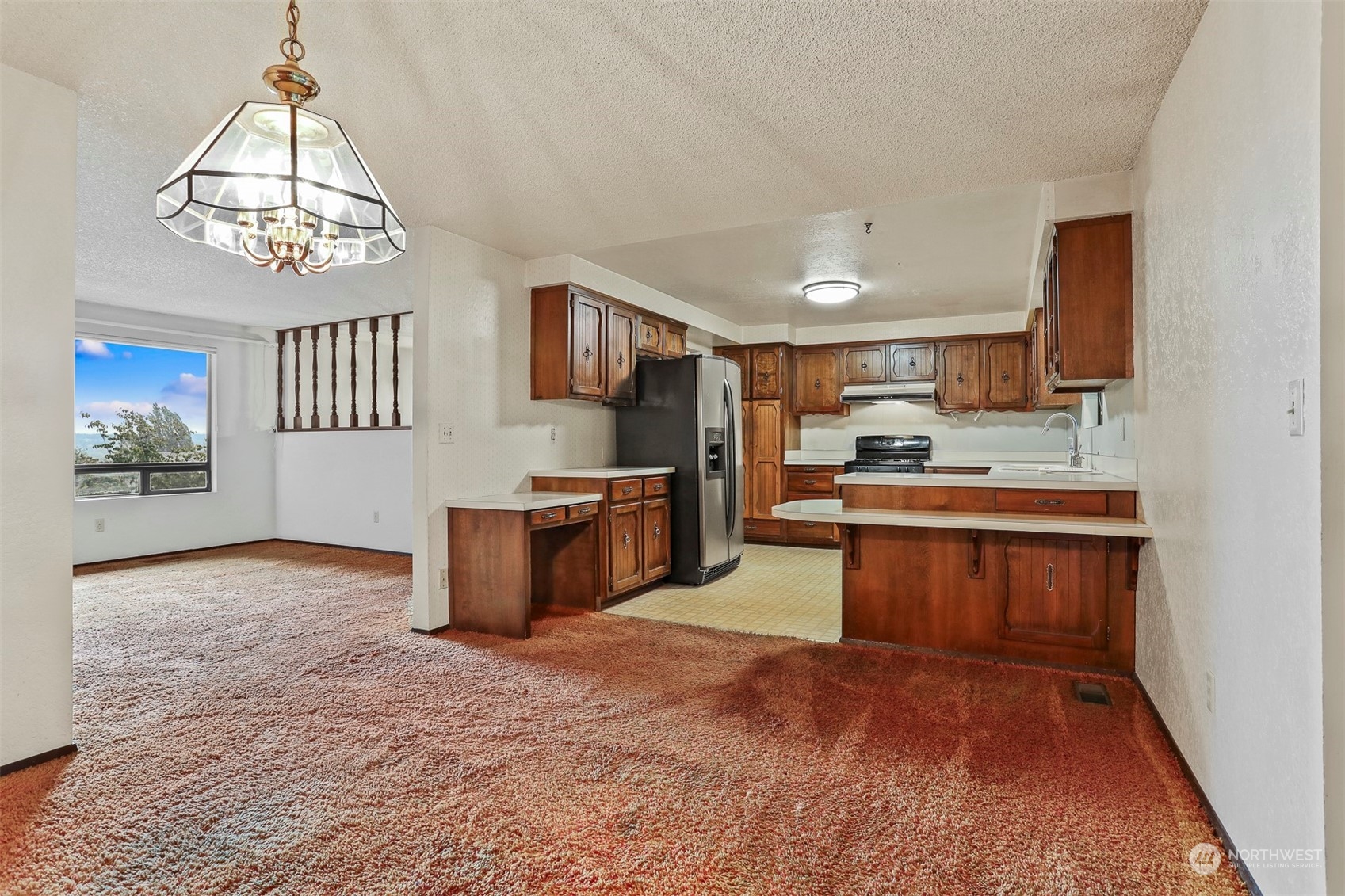 22224 4th Avenue Southeast Bothell, WA 98021 - Photo 5 of 23 a kitchen with a refrigerator and a sink