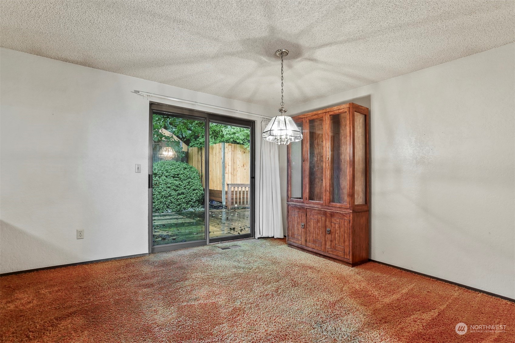 22224 4th Avenue Southeast Bothell, WA 98021 - Photo 7 of 23 an empty room with chandelier fan and windows