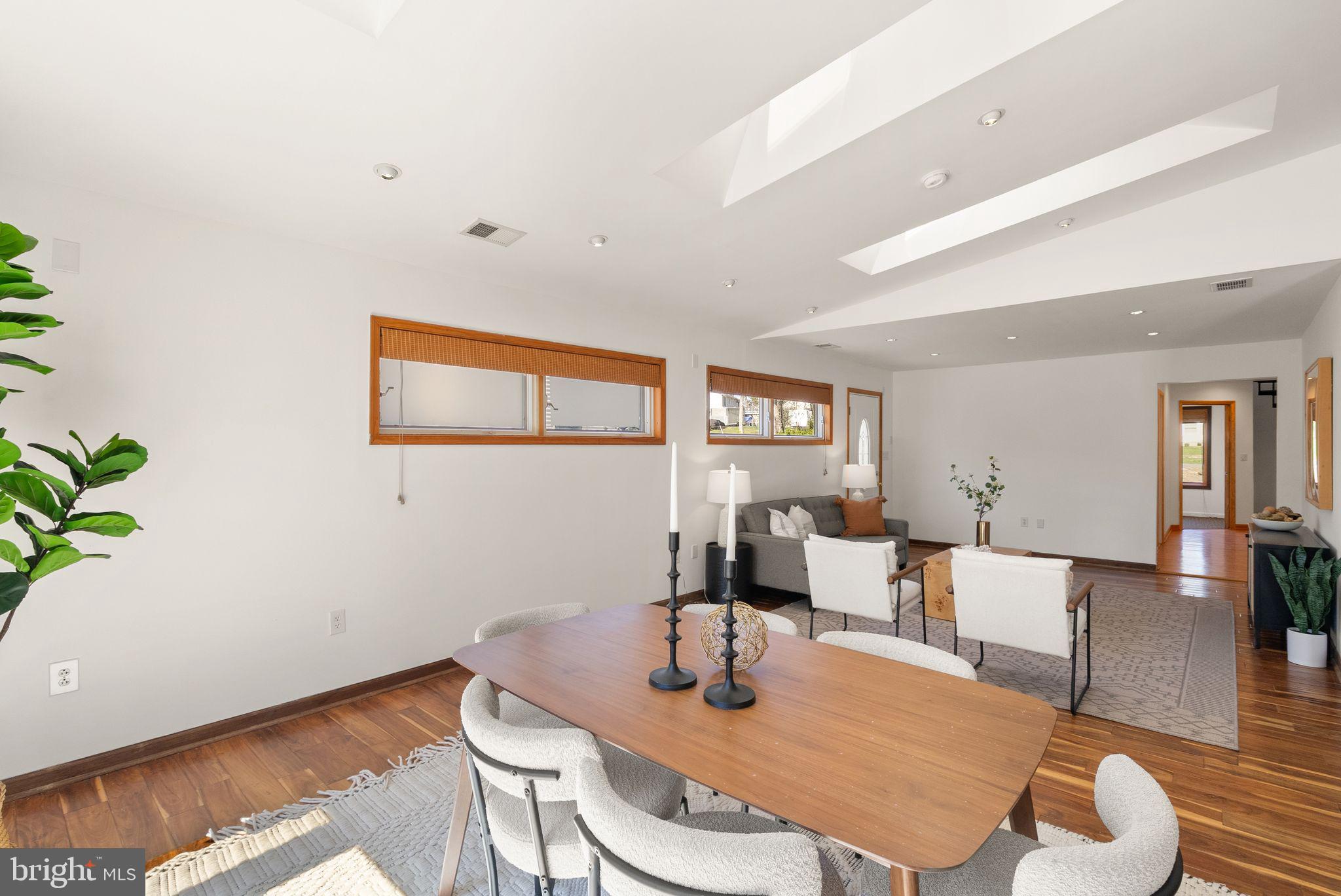 8737 Redman Street Springfield, VA 22153 - Photo 17 of 62 a dining room with furniture and wooden floor