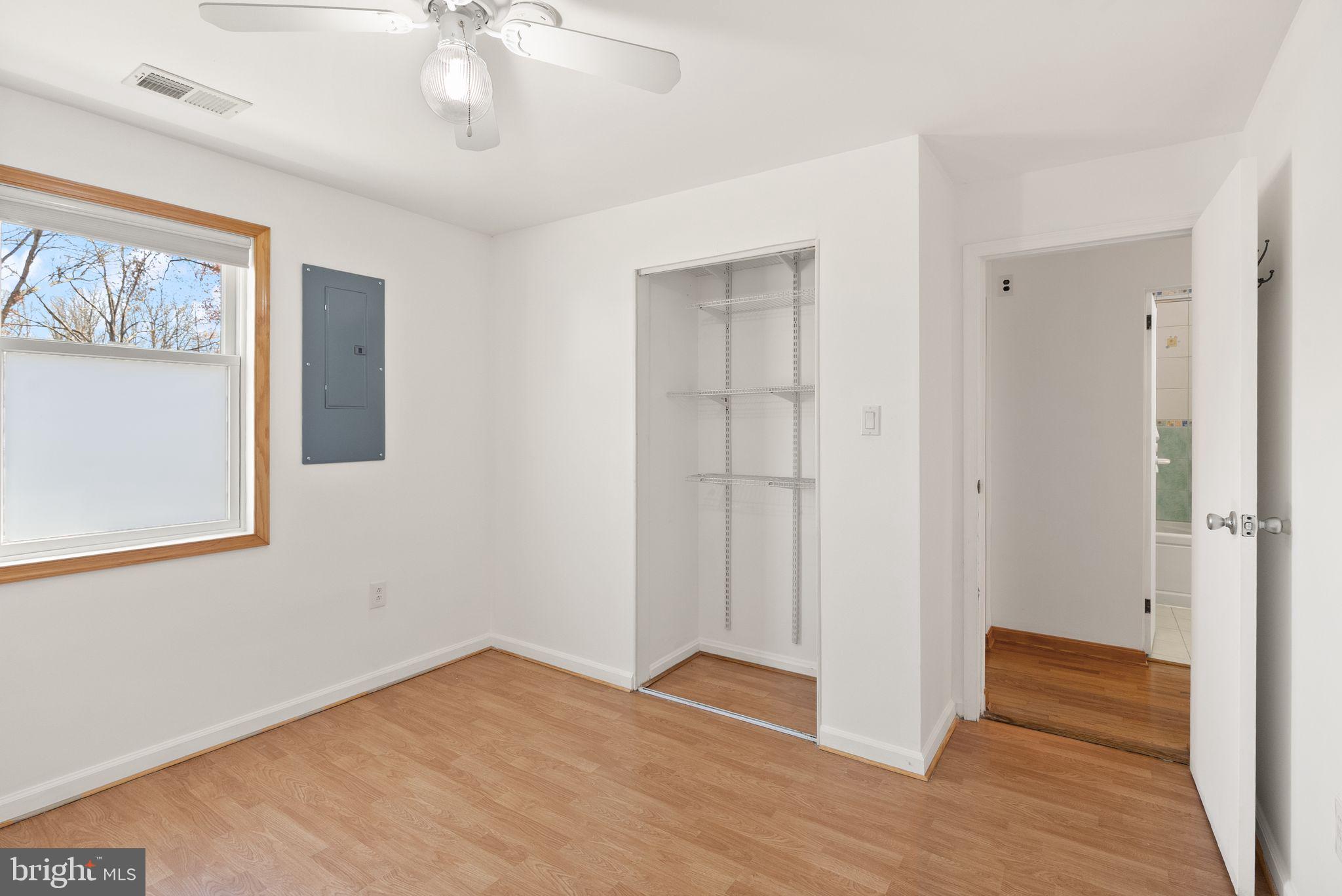 8737 Redman Street Springfield, VA 22153 - Photo 32 of 62 a view of an empty room with wooden floor