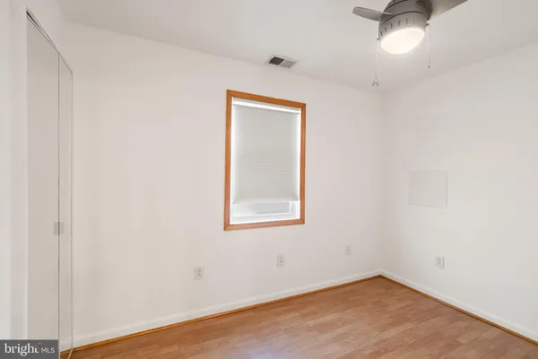 a view of hallway with a large window and entryway