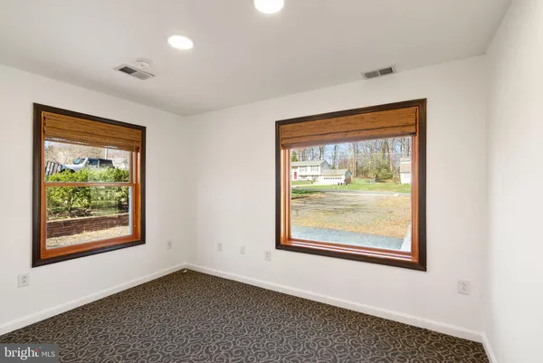 a view of a livingroom with furniture and a window