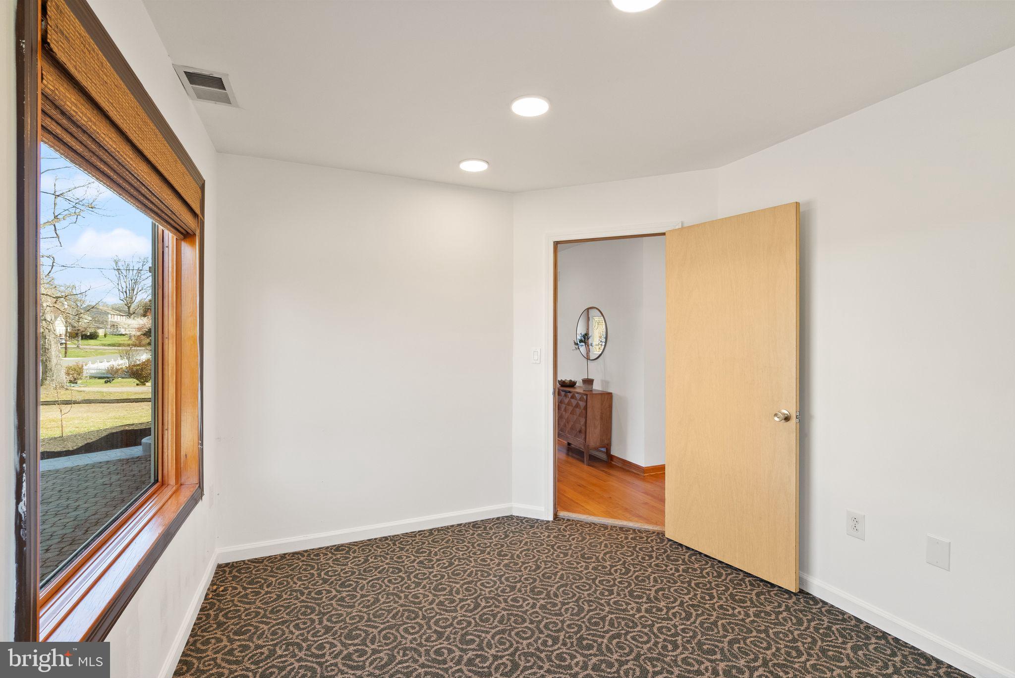 8737 Redman Street Springfield, VA 22153 - Photo 38 of 62 a view of hallway with a large window and entryway