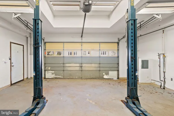 a front view of house with backyard and green space