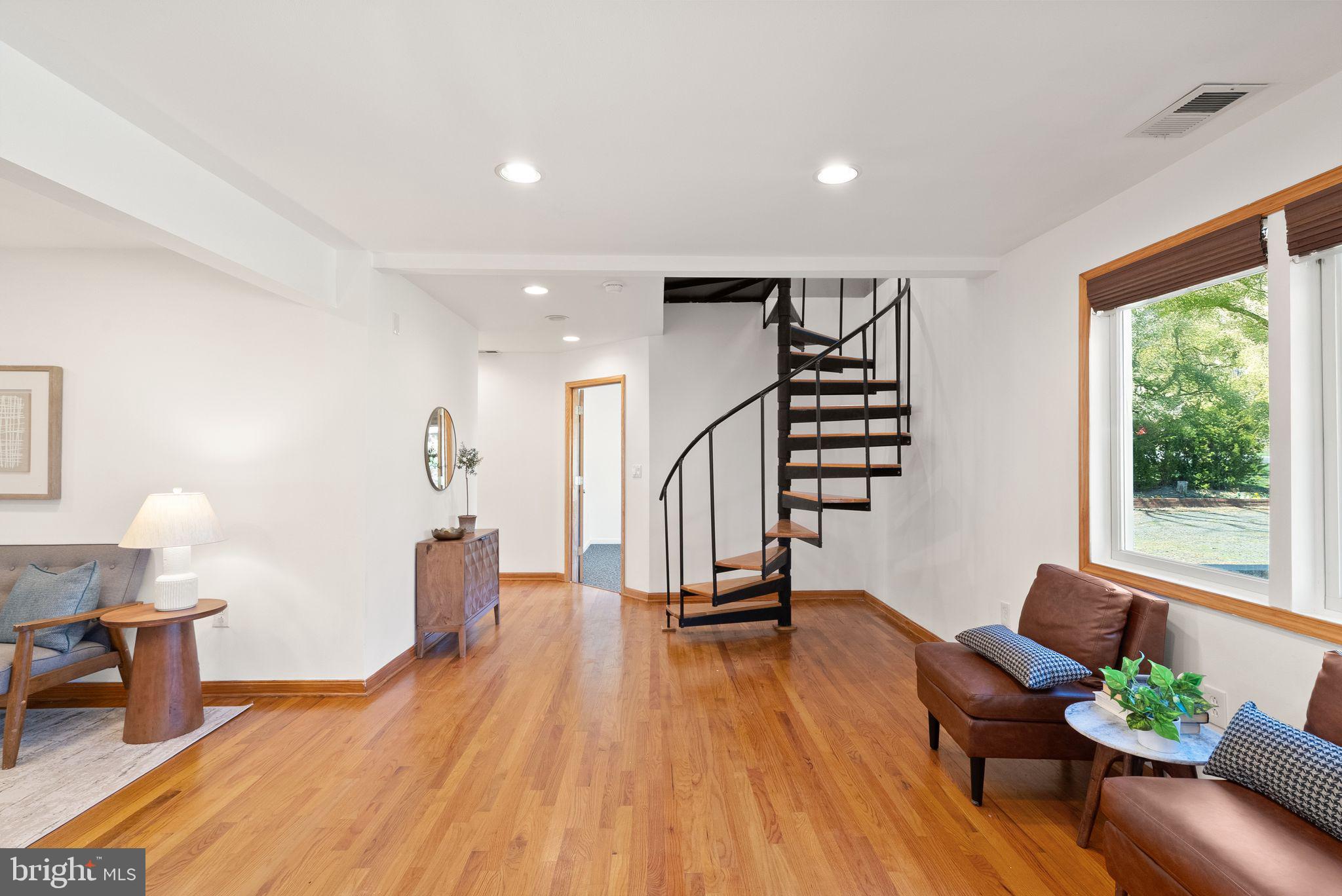 8737 Redman Street Springfield, VA 22153 - Photo 5 of 62 a living room with furniture and a wooden floor
