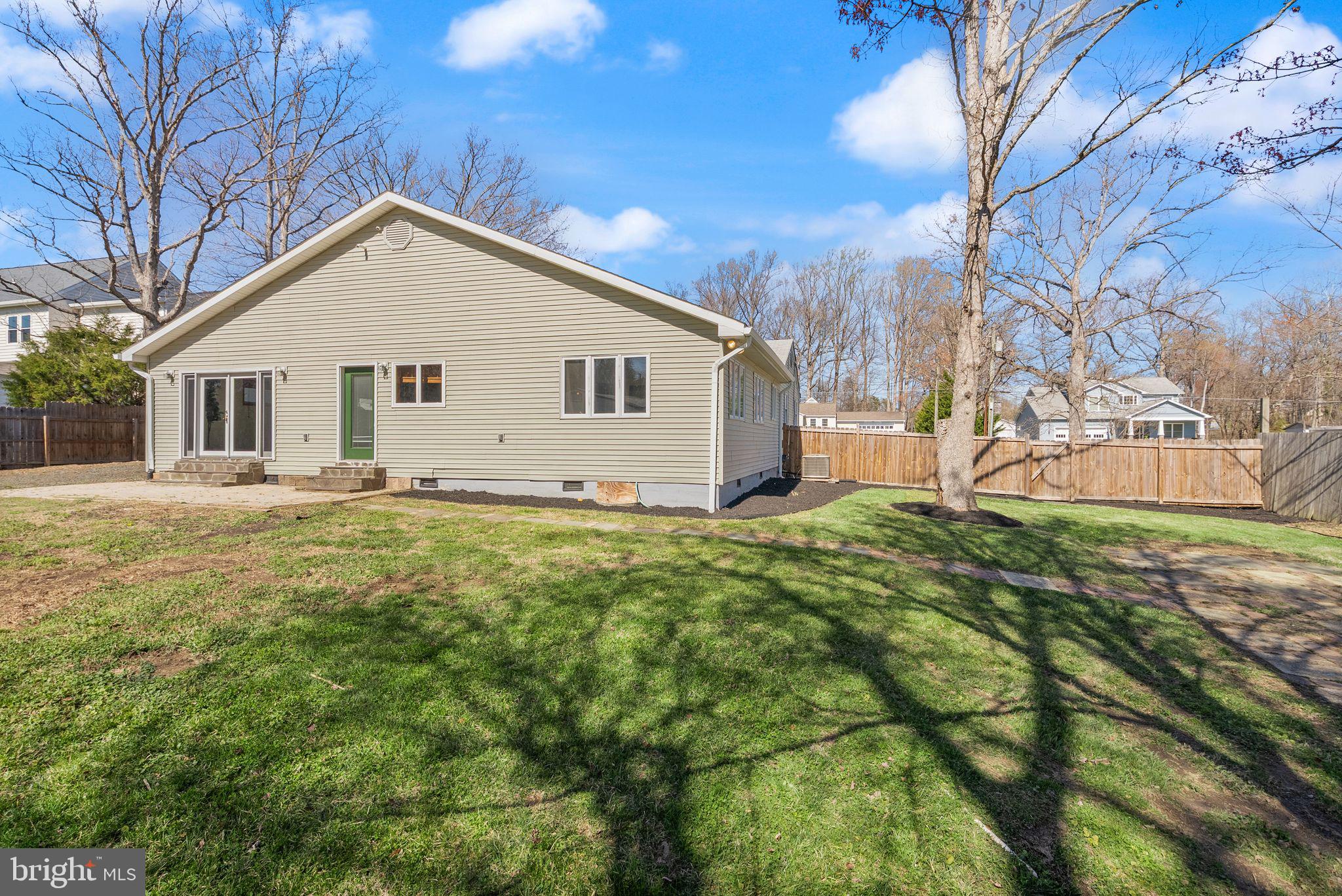 8737 Redman Street Springfield, VA 22153 - Photo 55 of 62 a view of a house with a yard
