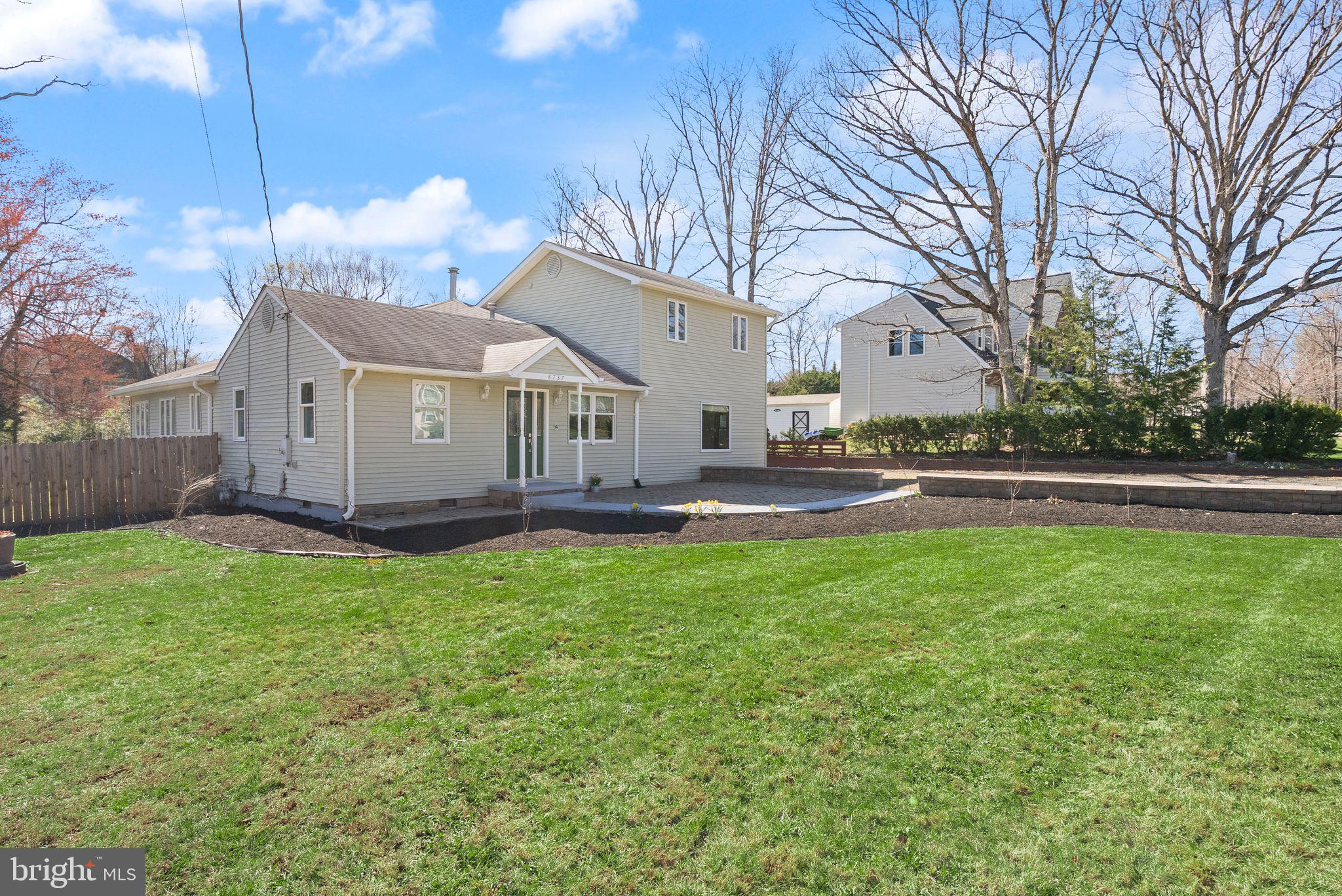 8737 Redman Street Springfield, VA 22153 - Photo 56 of 62 a view of a house with backyard and a tree