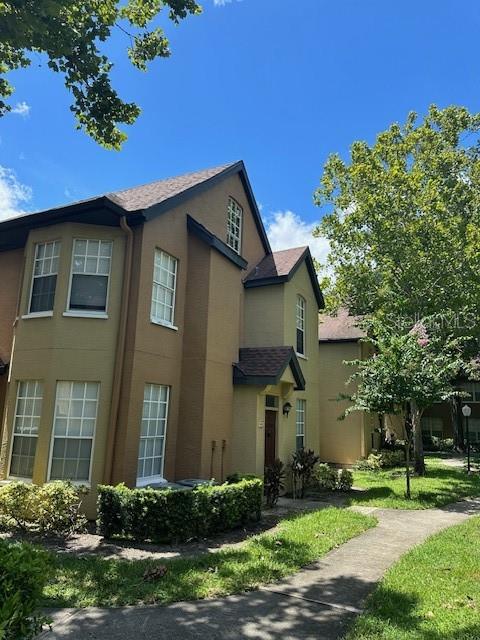 6364 Raleigh Street, Unit 1603 Orlando, FL 32835 - Photo 1 of 1 a house view with a garden space