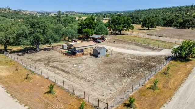 a view of a backyard with sitting area