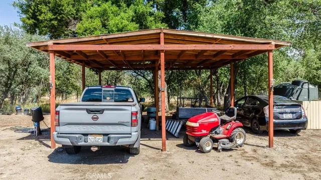 a view of a patio with table and chairs a barbeque